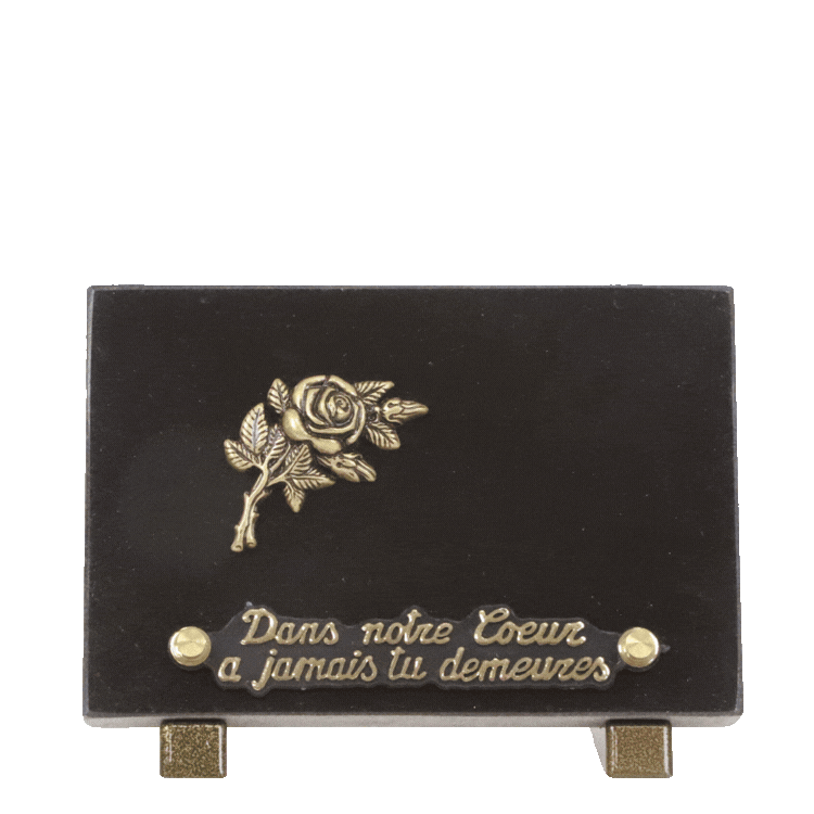 Nine small memorial grave plaques on dark and red granite with gold floral, wheat sheaf and dove embellishments arranged in three rows