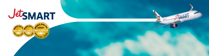 JetSMART logo and aircraft flying over a blue sky with Skytrax award badges