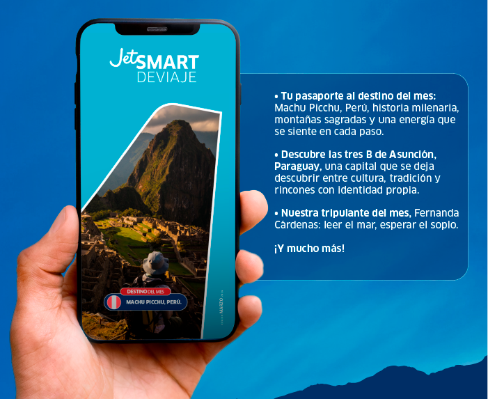 Hand holding smartphone showing JetSMART Deviaje travel promo with Machu Picchu photo and Spanish promotional text on blue background