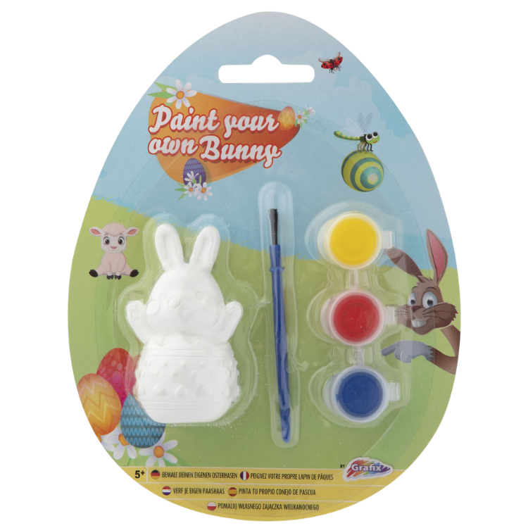 Paint-your-own Easter bunny kit in egg-shaped pack showing white plaster bunny figure, brush and yellow, red and blue paints