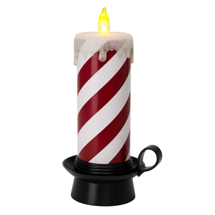 Battery-operated red and white striped LED candle with glittery faux wax drips and glowing flame, sitting in a black metal chamberstick holder