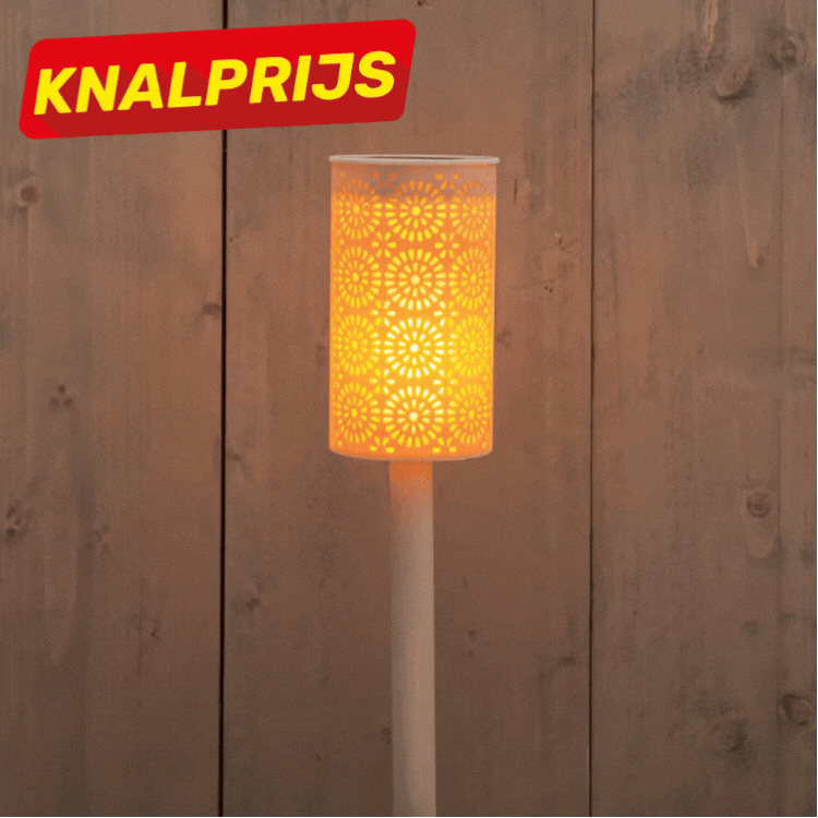 Three decorative outdoor solar stake lights with perforated floral metal shades glowing warm against a wooden fence, sale badge