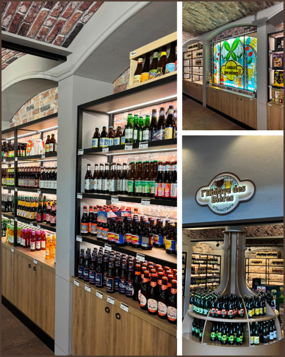 Interior of boutique beer shop with wooden shelves of craft beer bottles, arched brick ceiling, stained-glass logo window