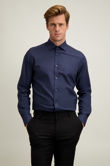 Man modelling navy long-sleeve slim-fit men's dress shirt tucked into black trousers, hands in pockets, neutral background