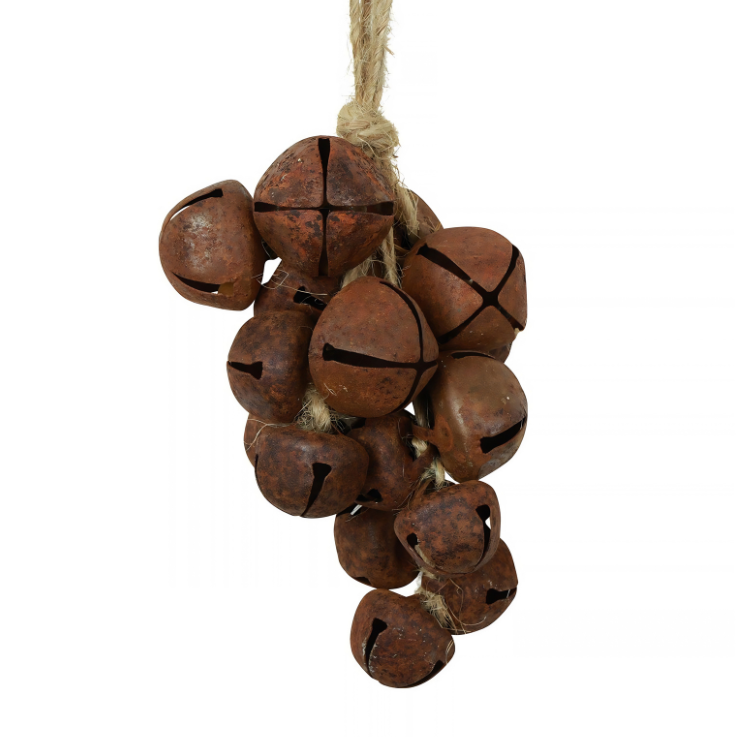 Cluster of rusty vintage jingle bells tied with natural twine, hanging decorative sleigh bells for rustic Christmas décor