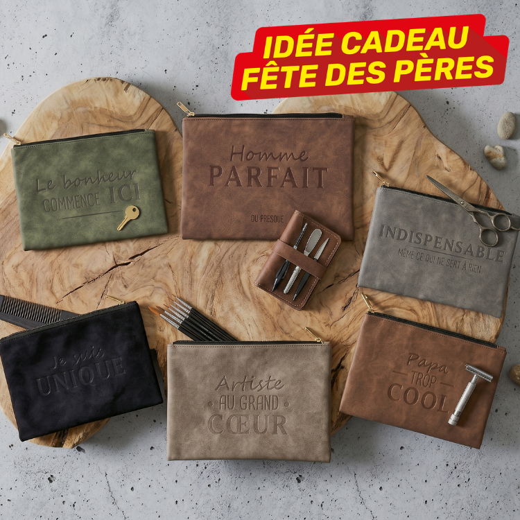 Flatlay of six leather pouches with embossed French phrases and a small manicure set on a wooden slab, red 'Idée cadeau Fête des Pères' banner