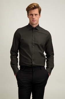 Male model wearing dark olive long-sleeve dress shirt and black trousers, hands in pockets against plain background