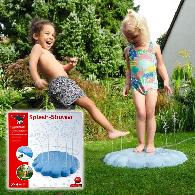 Two children playing on a blue splash-shower sprinkler playmat in a sunny garden as water jets spray around the round pad