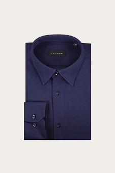 Folded navy blue men's long-sleeve dress shirt with pointed collar and buttoned cuff on a light neutral background