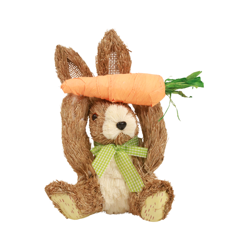 Easter decorative straw bunny toy with green gingham bow holding a large orange carrot overhead on white background