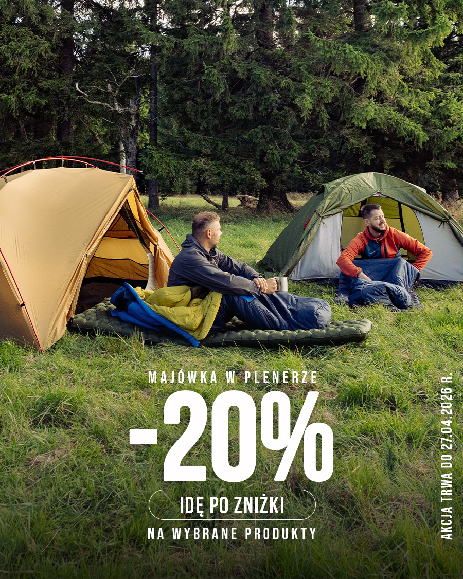 Two men sitting on sleeping mats beside tents in a forest clearing, camping outdoors, with -20% discount text overlay