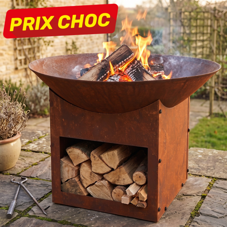 Rustic steel fire pit with burning logs and under-storage of stacked firewood on a stone patio, promotional 'PRIX CHOC' banner