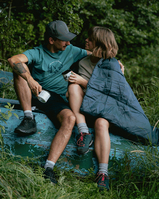 Collage of family camping scenes: couple and children by a lake and tent, hiking boots, kayaks and reading a map
