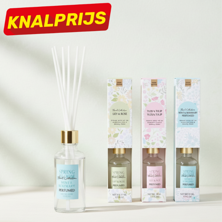Reed diffuser with white reeds and gold cap beside three floral refill boxes (Lily & Rose, Yuzu & Tulip) and a red KNALPRIJS sale badge