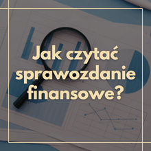 How to read a financial report? Magnifying glass over financial charts and graphs on a business document, close-up
